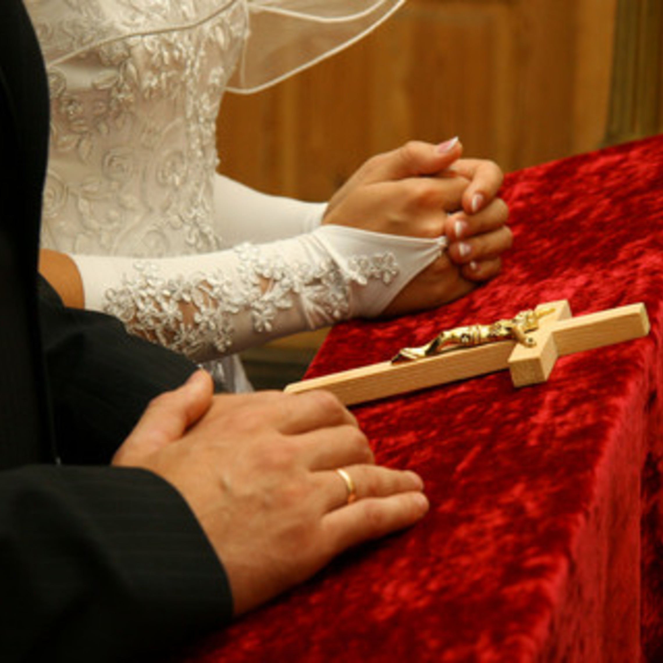 Couple Kneeling With Crucifix
