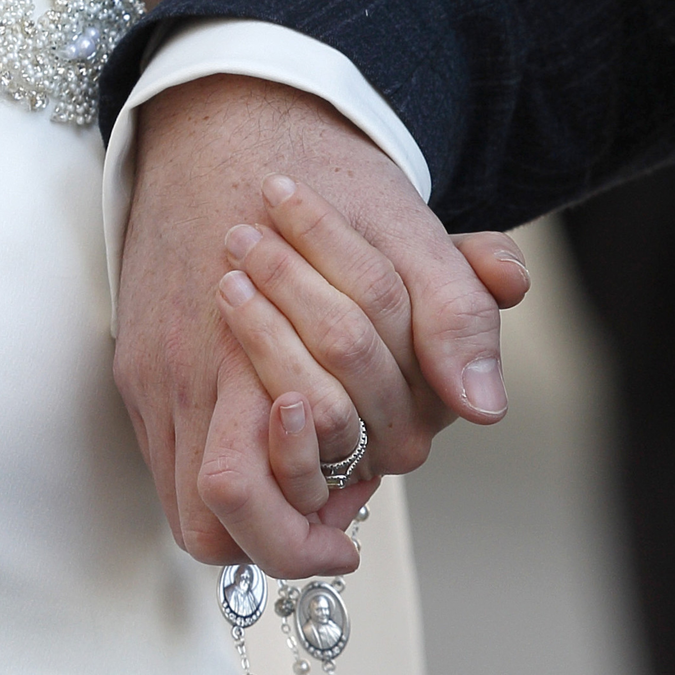 Married Couple Holding Hands