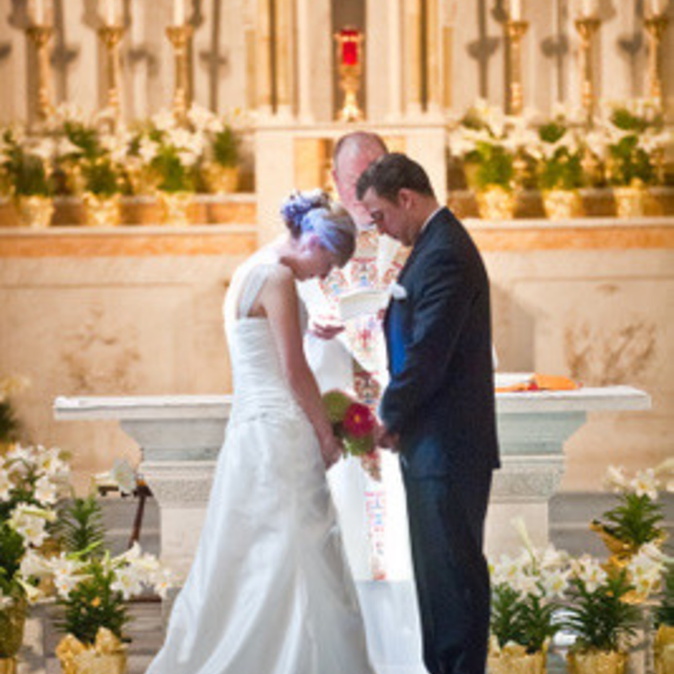 Wedding Couple Bowing In Prayer